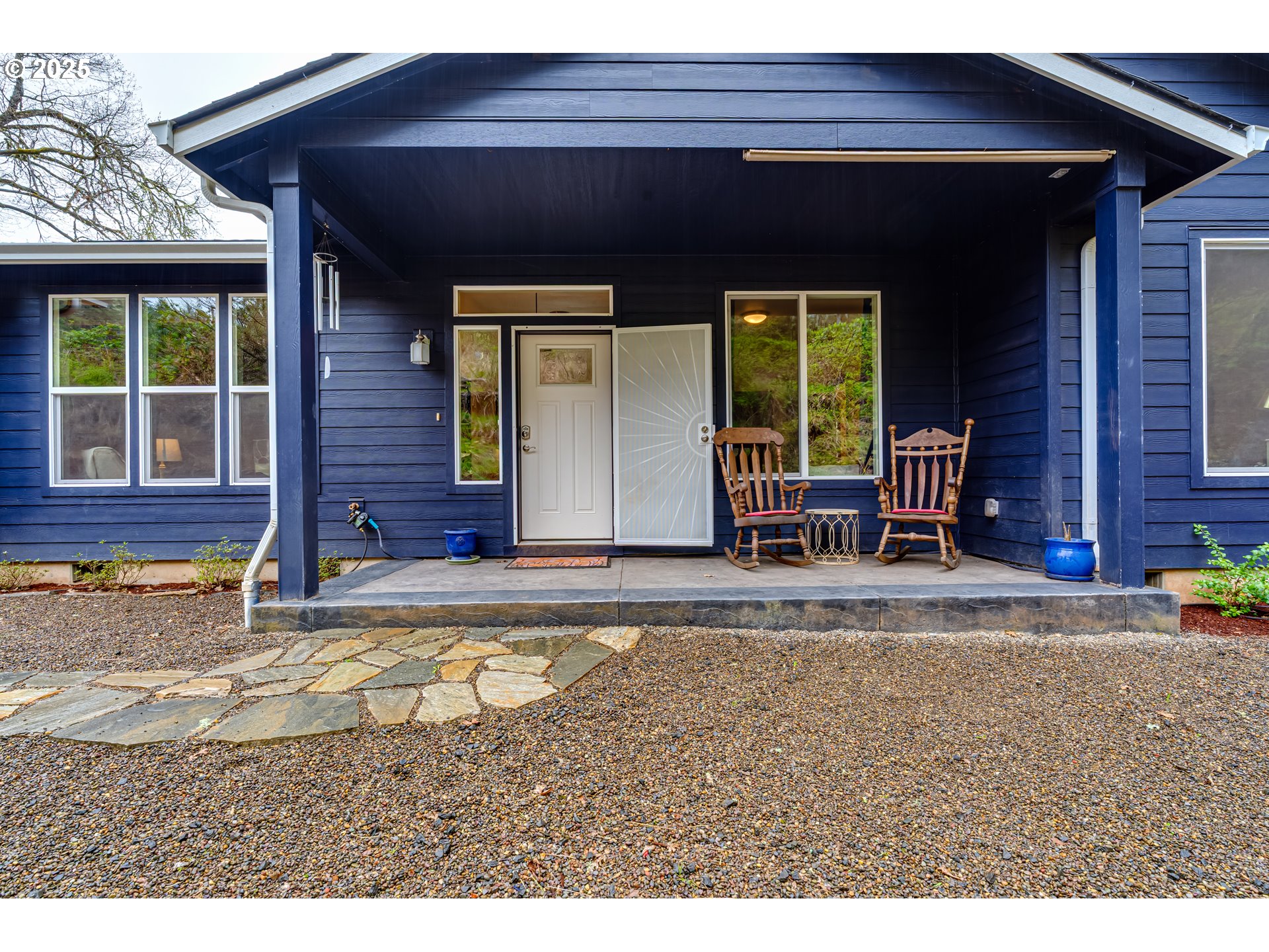 31490 Fox Hollow Road Eugene, OR 97405 - Photo 3 of 40 a front view of a house with garden