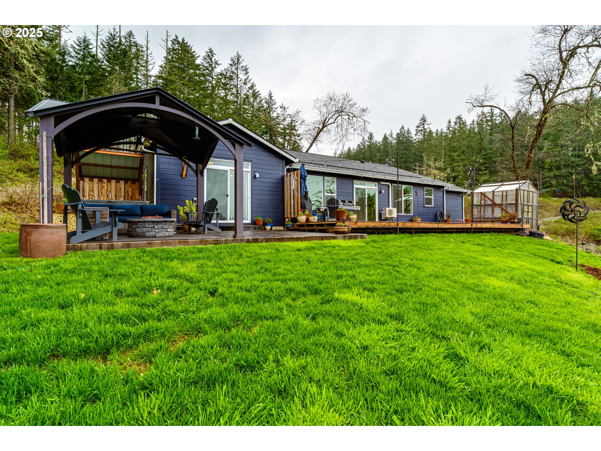 31490 Fox Hollow Road Eugene, OR 97405 - Photo 40 of 40 a view of a house with backyard and sitting area