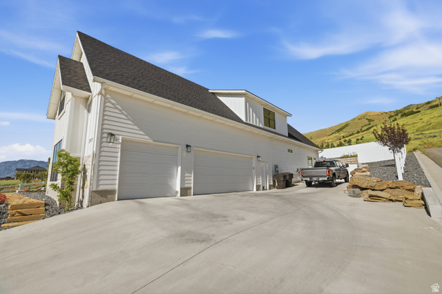 2013 South 100 West Perry, UT 84302 - Photo 5 of 49 Contemporary residence featuring white horizontal siding and a dark shingle roof