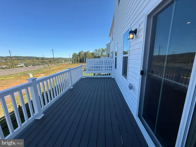 a view of balcony with wooden floor