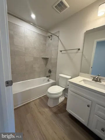 a bathroom with a toilet a sink and a bathtub