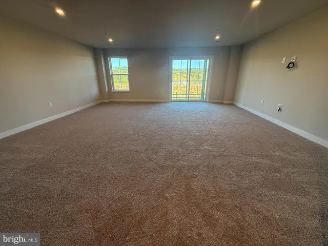 a bathroom with a sink toilet a mirror and shower
