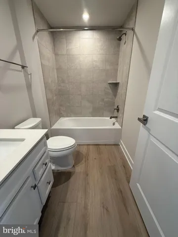 a view of a livingroom with an empty space and a window