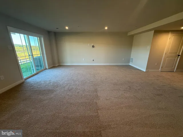 a view of a backyard with wooden fence