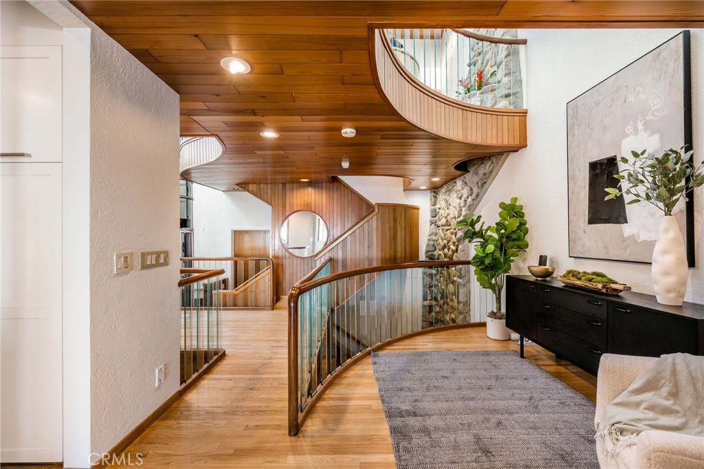 708 The Strand Manhattan Beach, CA 90266 - Photo 11 of 27 a living room with furniture and a chandelier