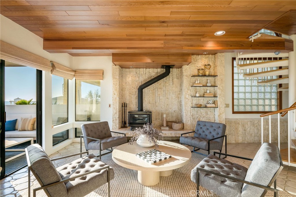 708 The Strand Manhattan Beach, CA 90266 - Photo 20 of 27 a living room with furniture and a table