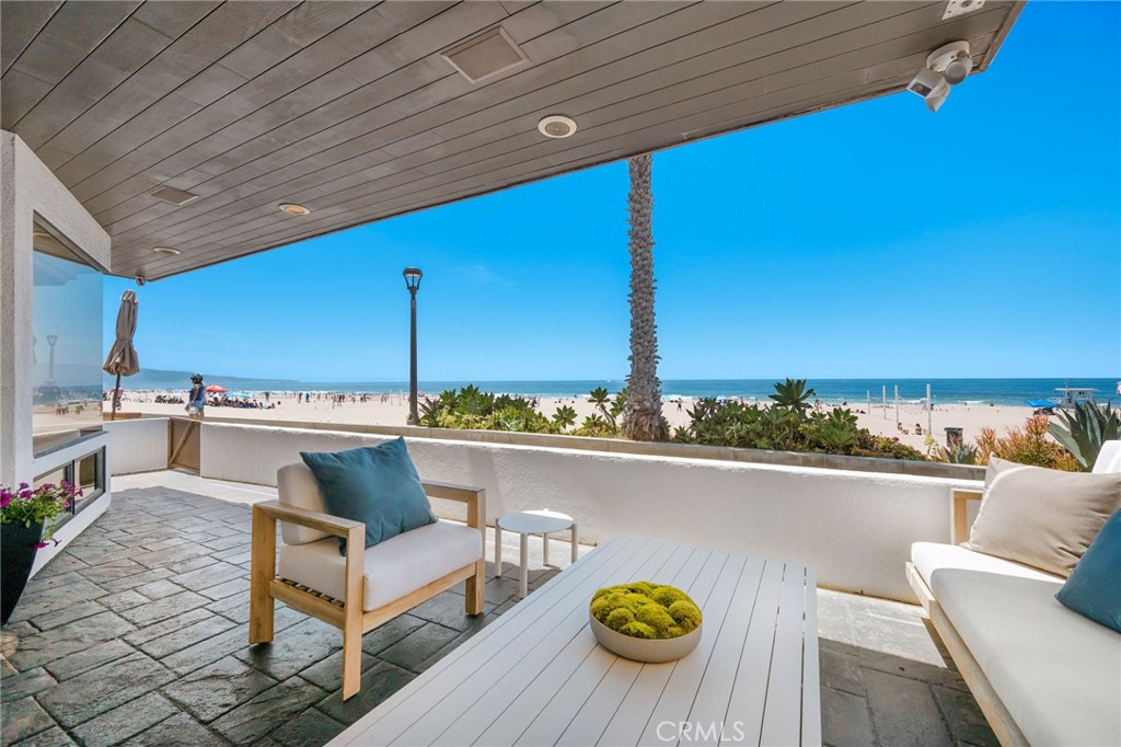 708 The Strand Manhattan Beach, CA 90266 - Photo 22 of 27 a roof deck with couches and potted plants