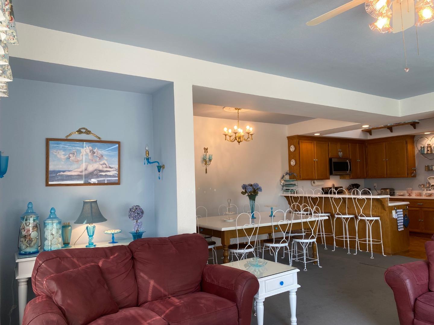122 2nd Avenue Santa Cruz, CA 95062 - Photo 13 of 86 a living room with furniture a flat screen tv and kitchen view