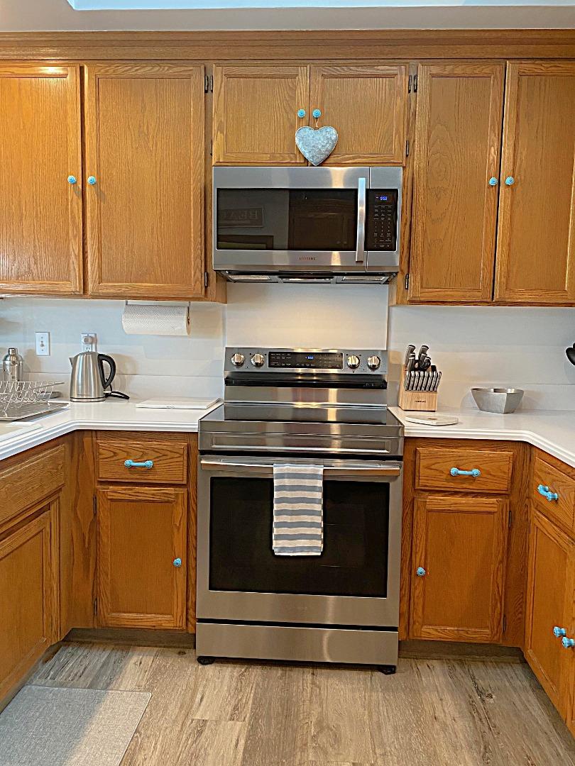 122 2nd Avenue Santa Cruz, CA 95062 - Photo 16 of 86 a kitchen with stainless steel appliances granite countertop a stove microwave and cabinets