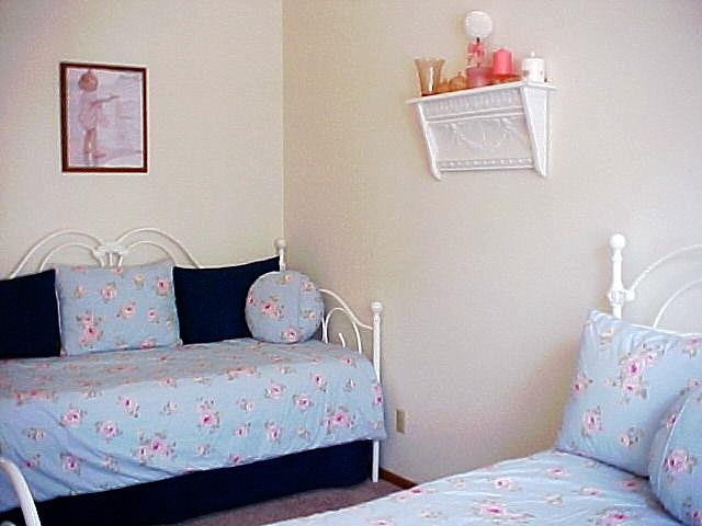 122 2nd Avenue Santa Cruz, CA 95062 - Photo 22 of 86 a bedroom with a bed and a table