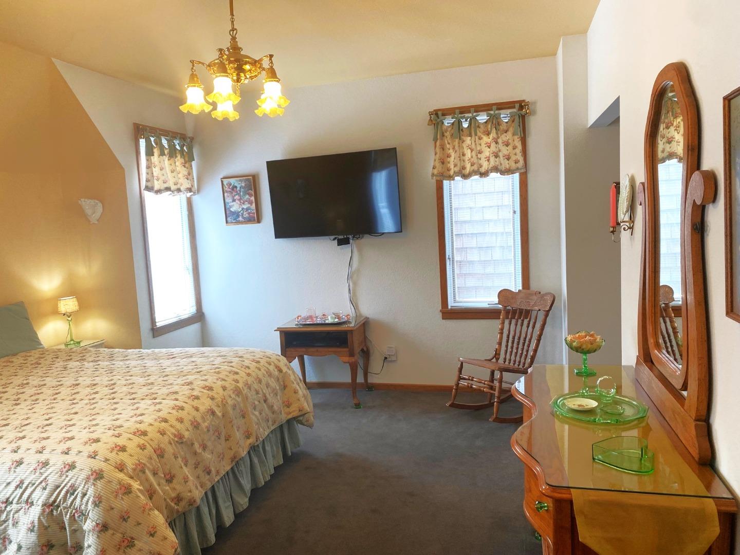 122 2nd Avenue Santa Cruz, CA 95062 - Photo 29 of 86 a bedroom with a bed and a flat screen tv