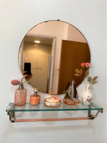 a kitchen with sink a large mirror and cabinets
