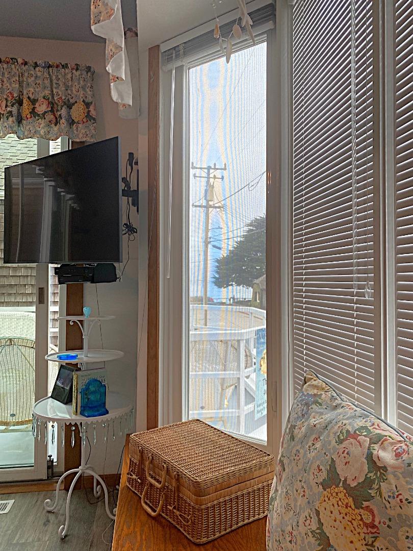 122 2nd Avenue Santa Cruz, CA 95062 - Photo 55 of 86 a bedroom with a bed tv and a window