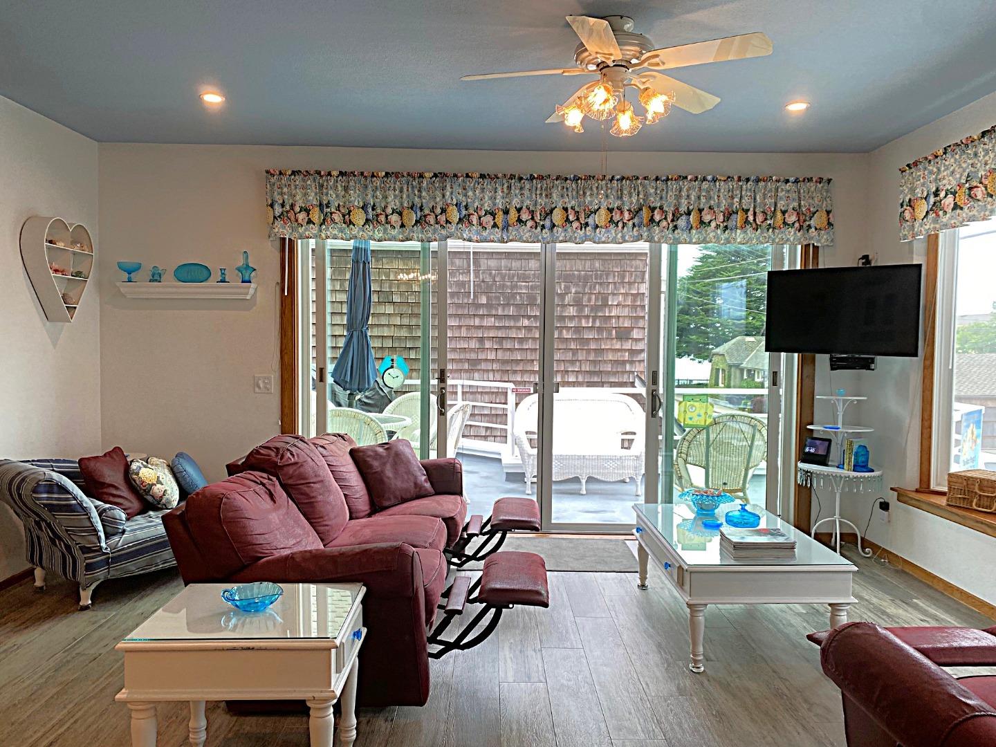 122 2nd Avenue Santa Cruz, CA 95062 - Photo 10 of 86 a living room with furniture a floor to ceiling window and wooden floor