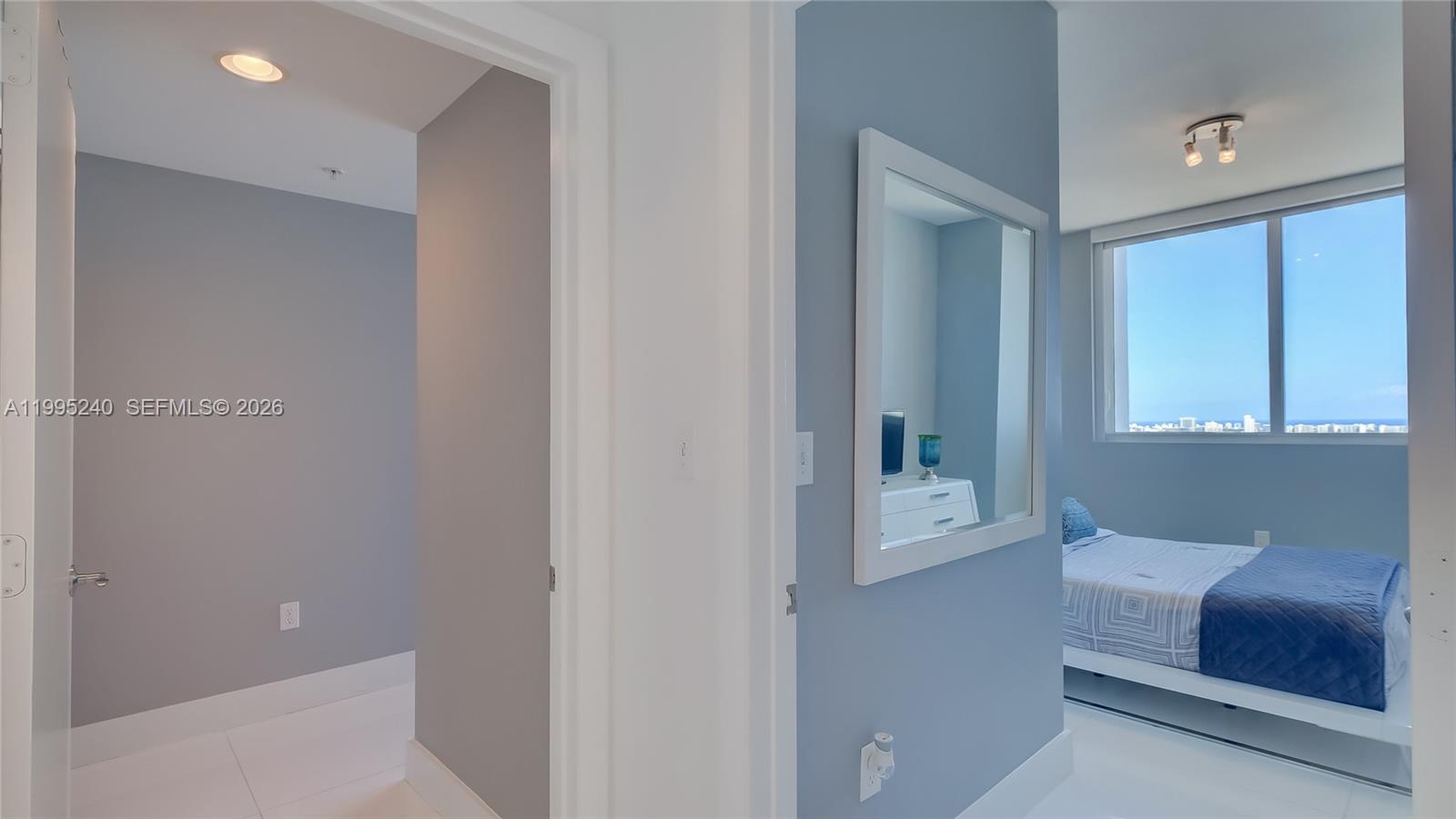253 Northeast 2nd Street, Unit 3509 Miami, FL 33132 - Photo 35 of 49 a hallway with a couch and a window