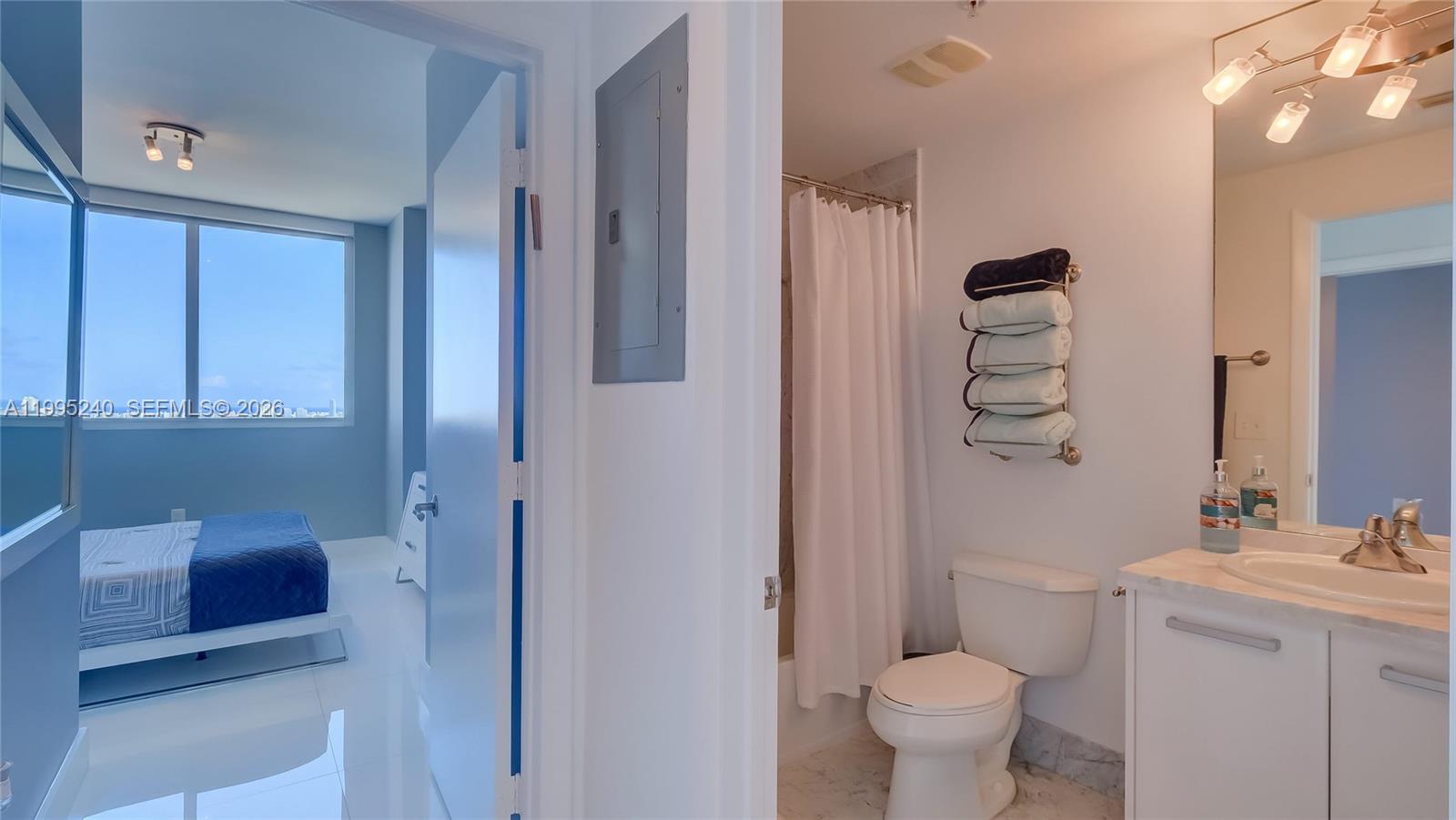253 Northeast 2nd Street, Unit 3509 Miami, FL 33132 - Photo 37 of 49 a bathroom with a sink a toilet and shower