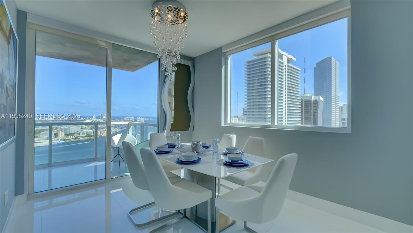 253 Northeast 2nd Street, Unit 3509 Miami, FL 33132 - Photo 4 of 49 a view of a dining room with furniture window and outside view