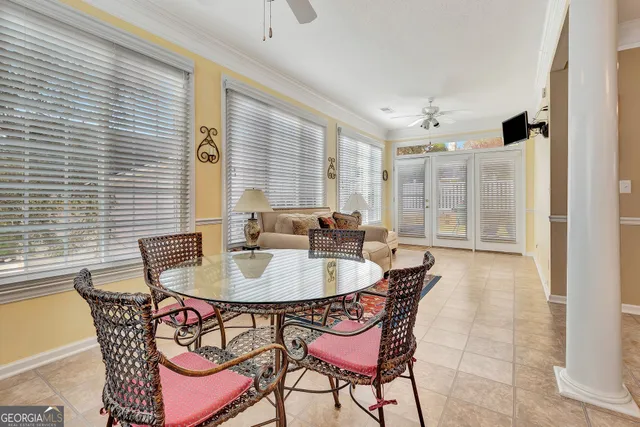 a dining room with furniture and window