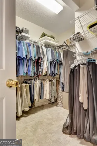a kitchen with a stove and white cabinets