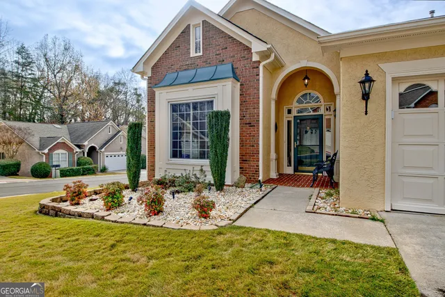 a front view of a house with garden
