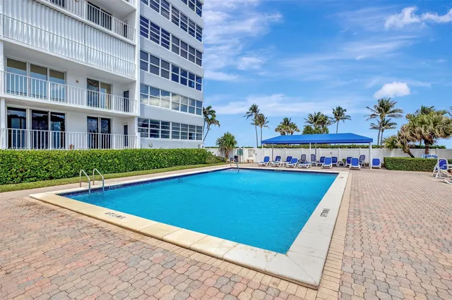 a view of a backyard with sitting area