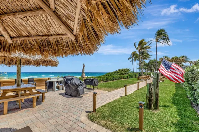 a view of a balcony with chairs and iron floor