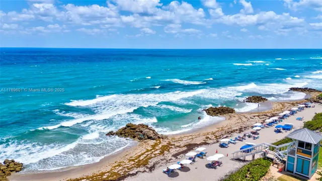 a view of a patio with swimming pool and outdoor seating