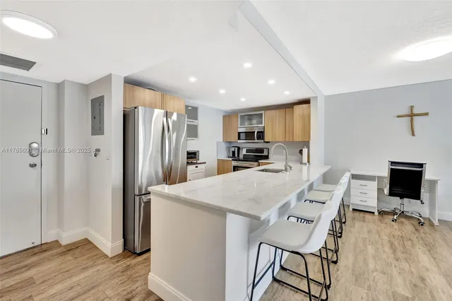 a kitchen with granite countertop a stove and a sink