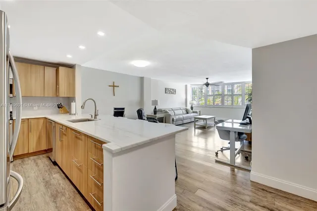 a kitchen with counter top space and sink