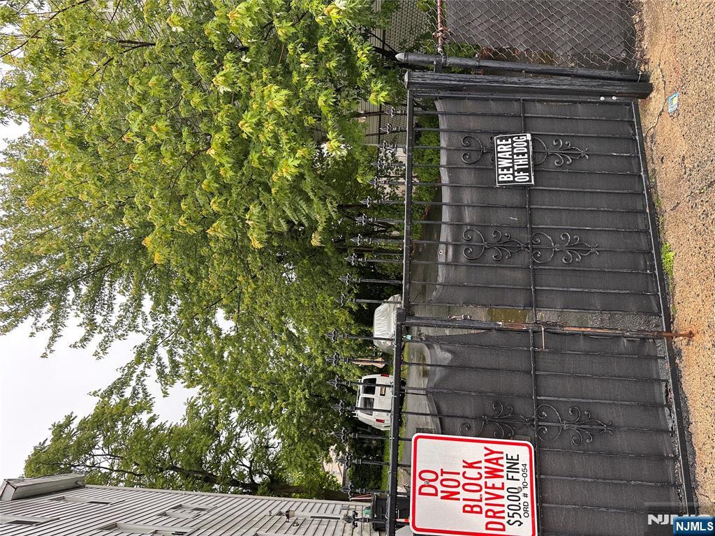 74 Pennington Street Paterson, NJ 07501 - Photo 1 of 1 a outdoor space with wooden fence