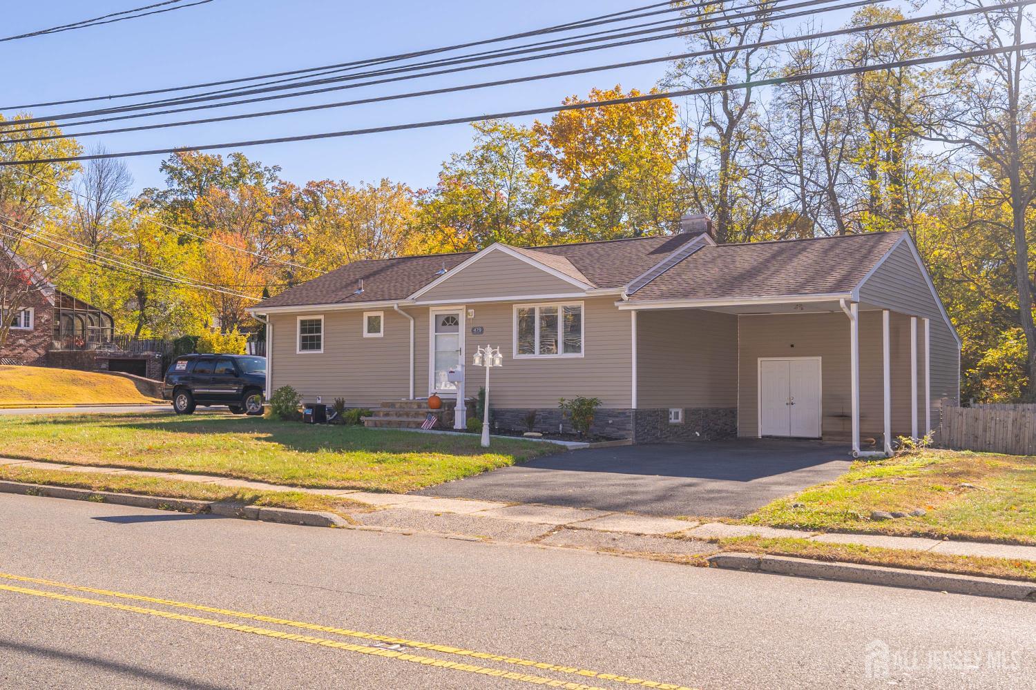 479 Chain O' Hills Road Colonia, NJ 07067 - Photo 1 of 18 a view of a house with a swimming pool