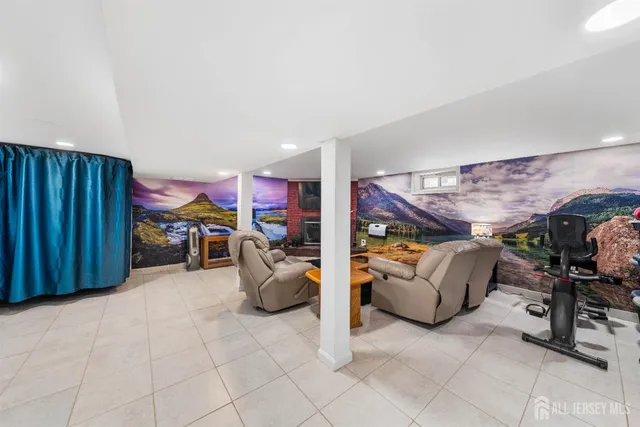 a kitchen with stainless steel appliances kitchen island granite countertop a refrigerator and a sink