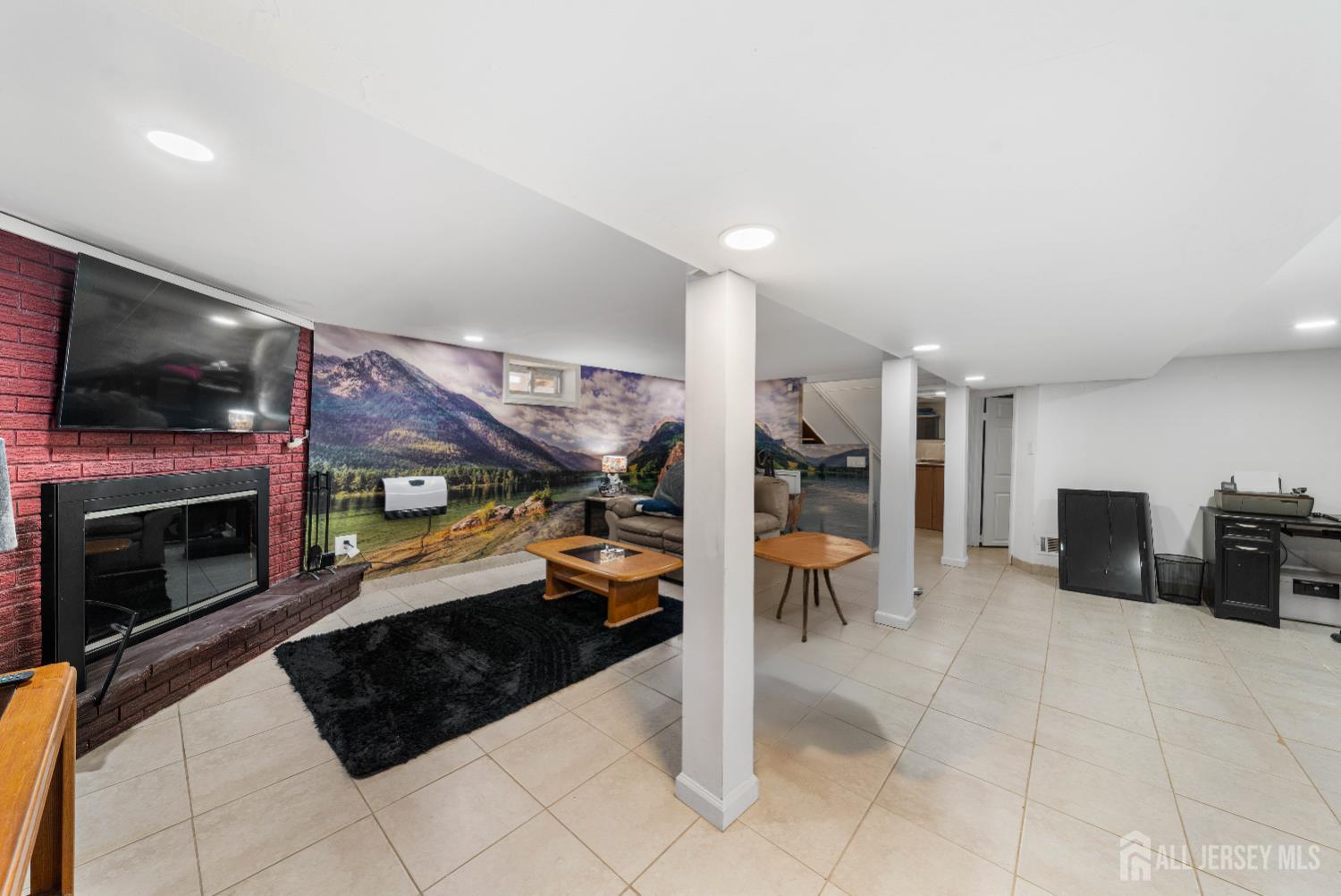 479 Chain O' Hills Road Colonia, NJ 07067 - Photo 16 of 18 a kitchen with stainless steel appliances kitchen island granite countertop a refrigerator and a sink