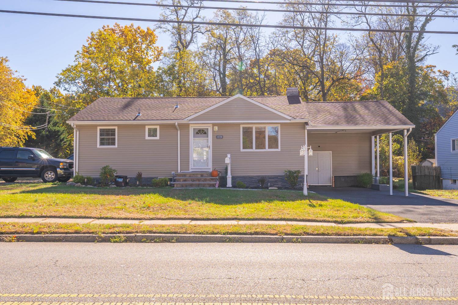 479 Chain O' Hills Road Colonia, NJ 07067 - Photo 2 of 18 a view of a house with swimming pool and a yard
