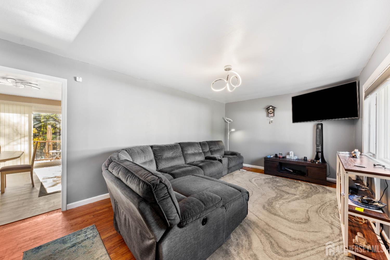 479 Chain O' Hills Road Colonia, NJ 07067 - Photo 3 of 18 a living room with furniture and a flat screen tv