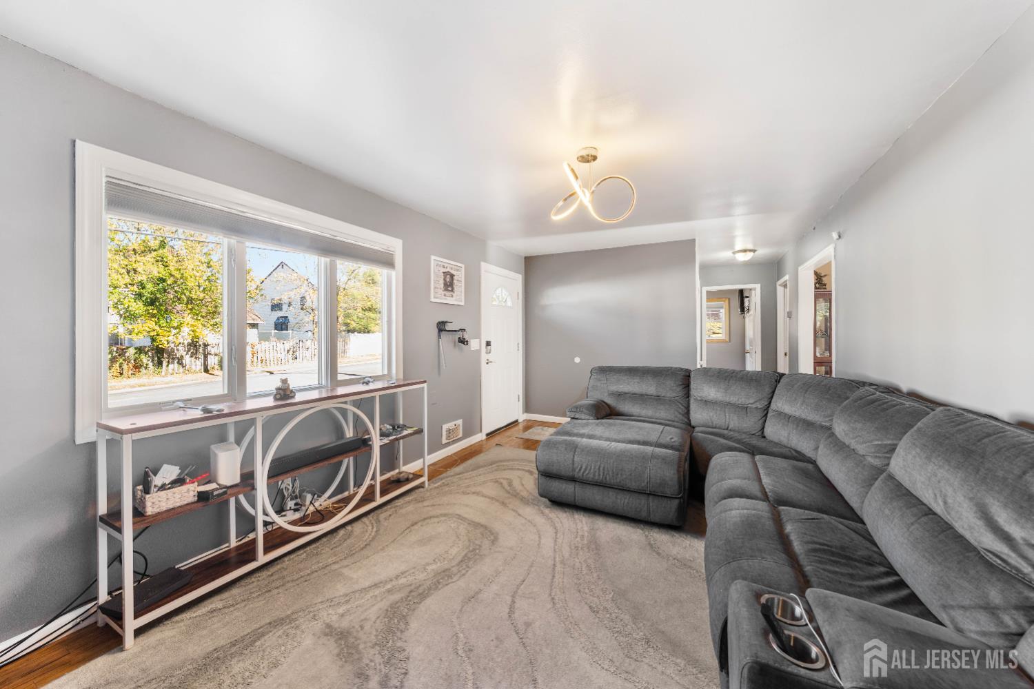 479 Chain O' Hills Road Colonia, NJ 07067 - Photo 4 of 18 a view of a livingroom with furniture and windows