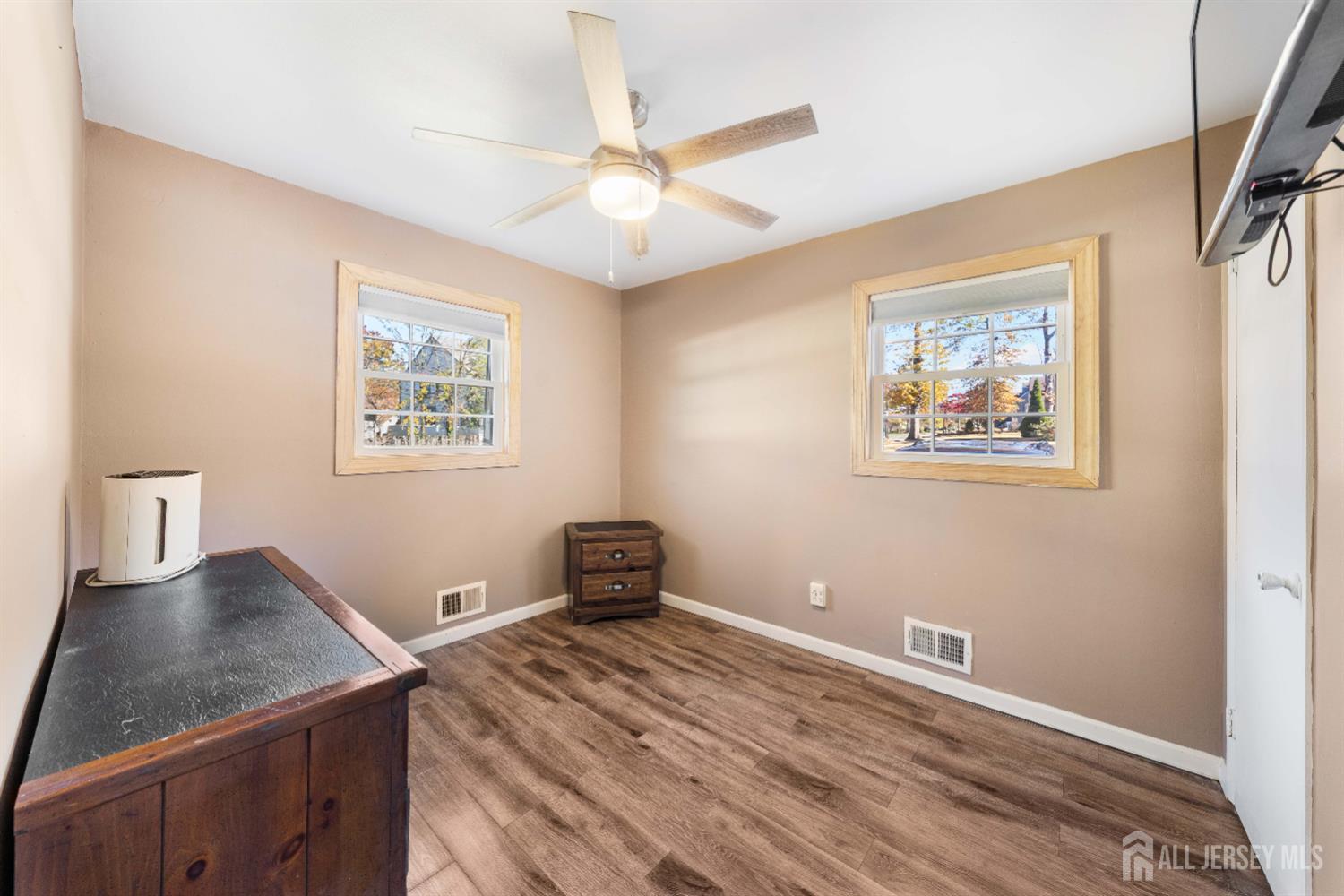 479 Chain O' Hills Road Colonia, NJ 07067 - Photo 9 of 18 a bedroom with a bed and a painting on the wall