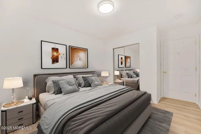 a bedroom with a bed and lamp