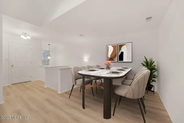 a view of a dining room with furniture