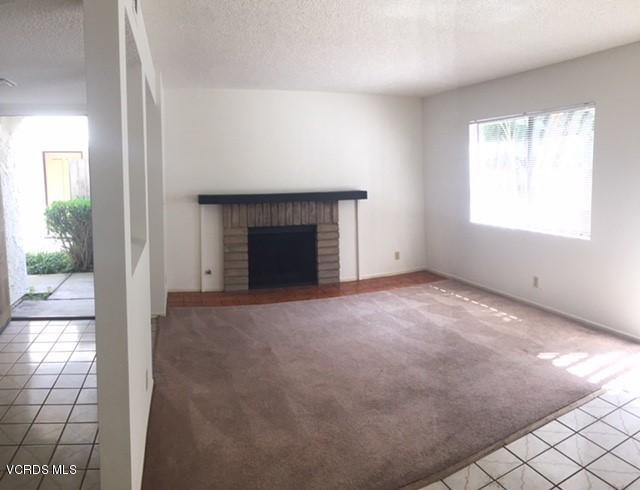312 East Bard Road Oxnard, CA 93033 - Photo 4 of 20 an empty room with windows and fireplace