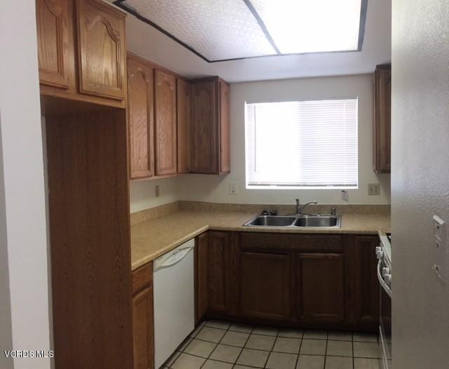312 East Bard Road Oxnard, CA 93033 - Photo 7 of 20 a kitchen with a sink and cabinets