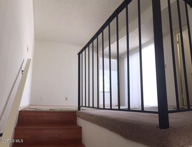 312 East Bard Road Oxnard, CA 93033 - Photo 9 of 20 a view of a staircase with wooden floor and a window