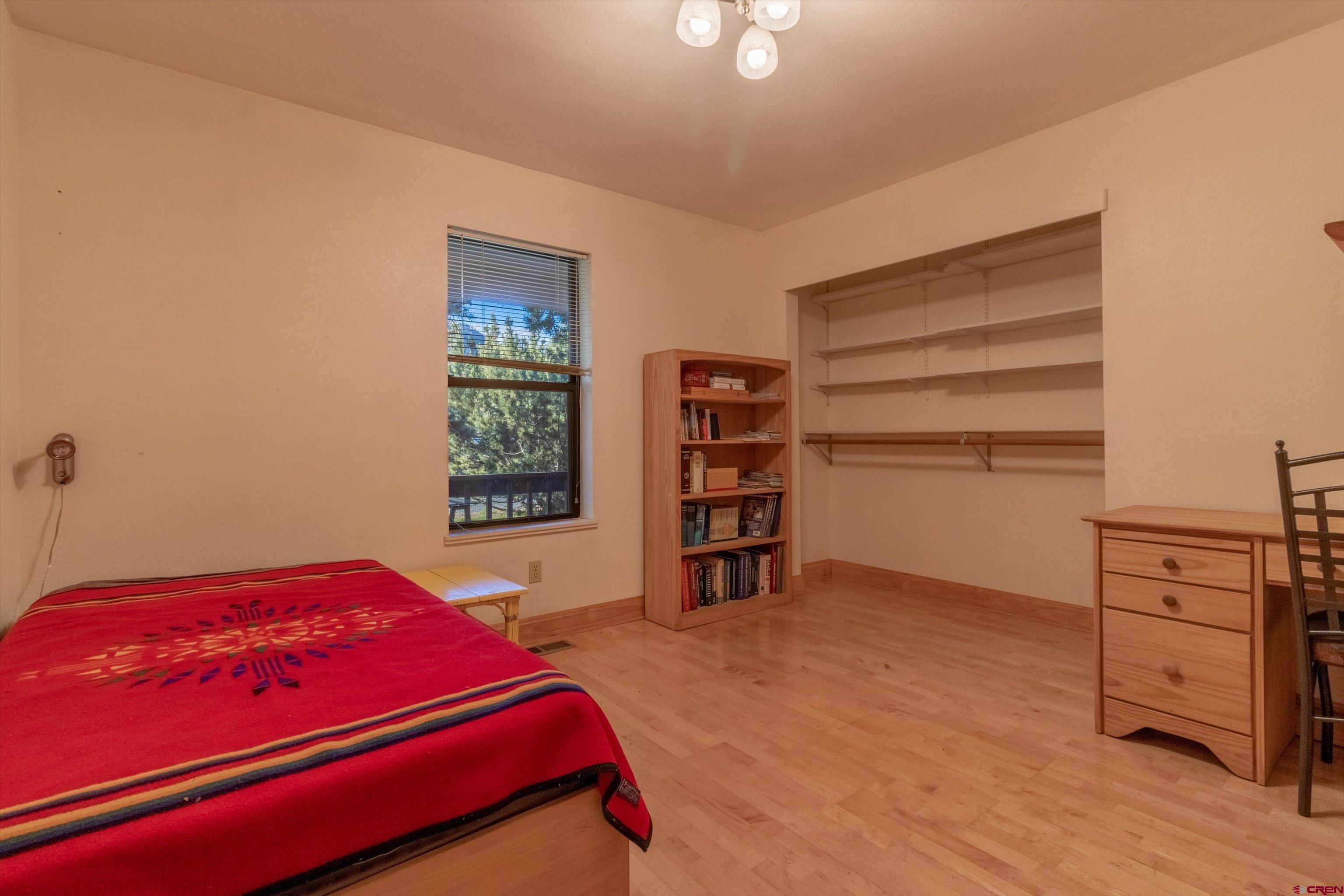 327 Hermosa Circle Durango, CO 81301 - Photo 15 of 32 a bedroom with a bed and a closet