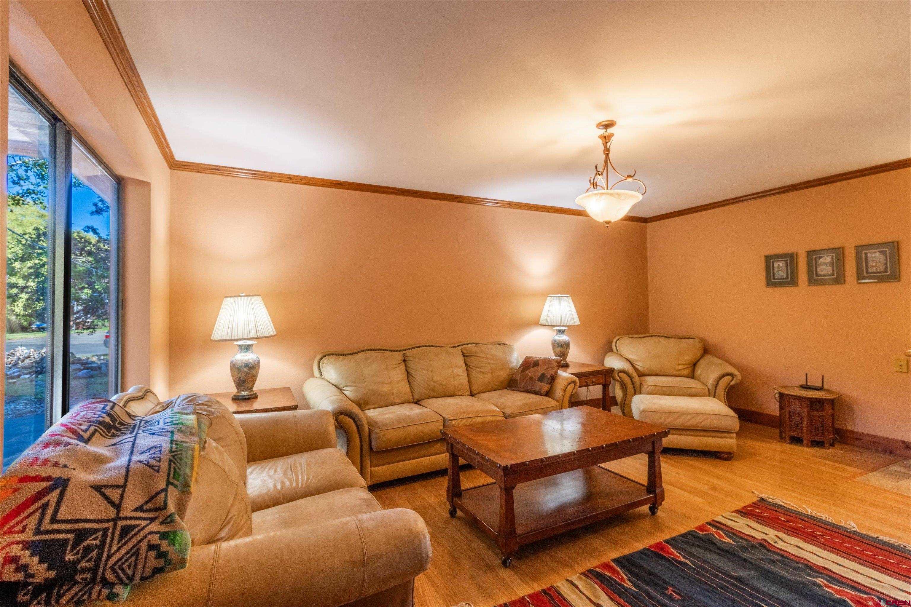 327 Hermosa Circle Durango, CO 81301 - Photo 20 of 32 a living room with furniture and a lamp