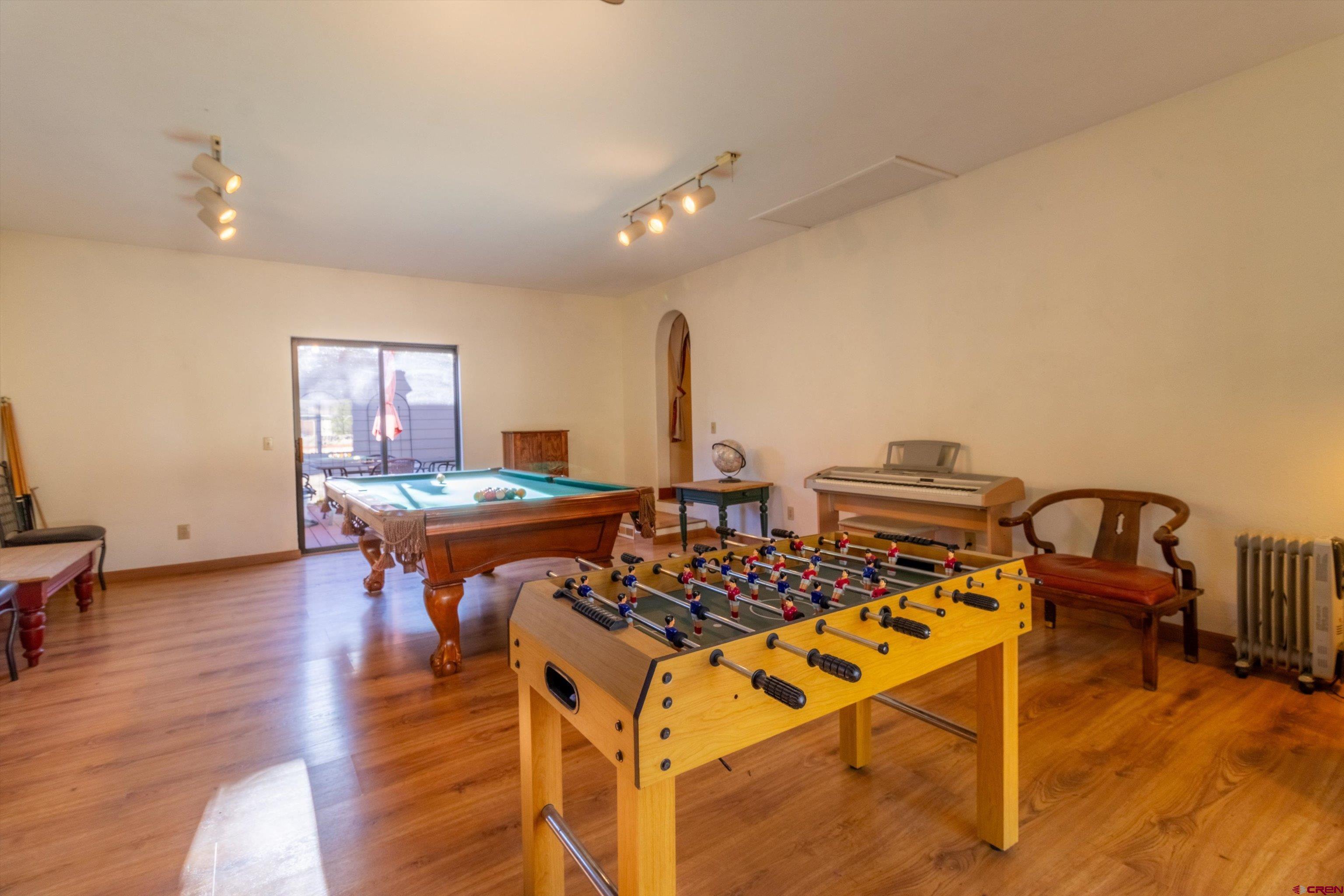 327 Hermosa Circle Durango, CO 81301 - Photo 22 of 32 a living room with furniture a table and wooden floor