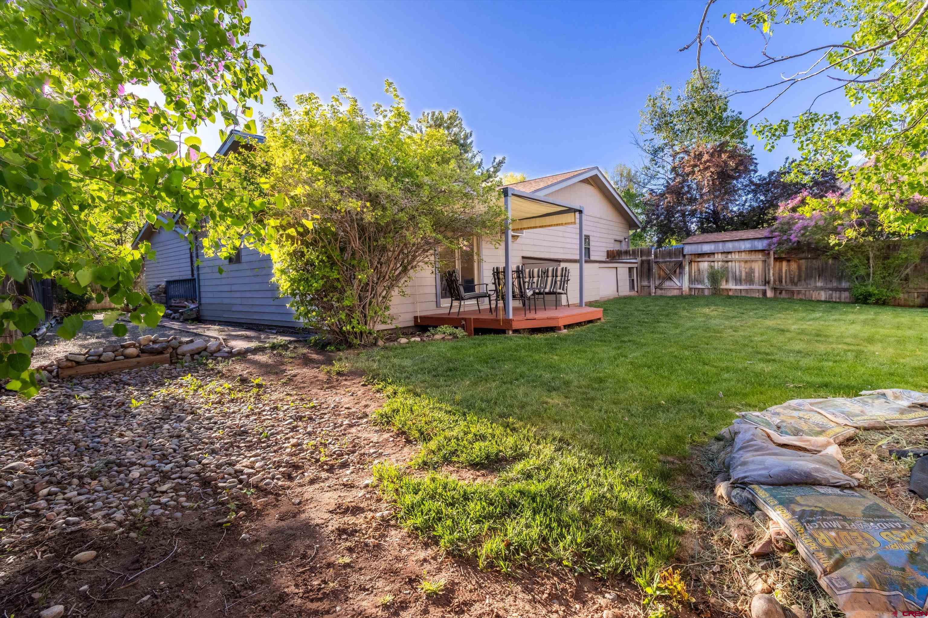 327 Hermosa Circle Durango, CO 81301 - Photo 24 of 32 a front view of a house with garden