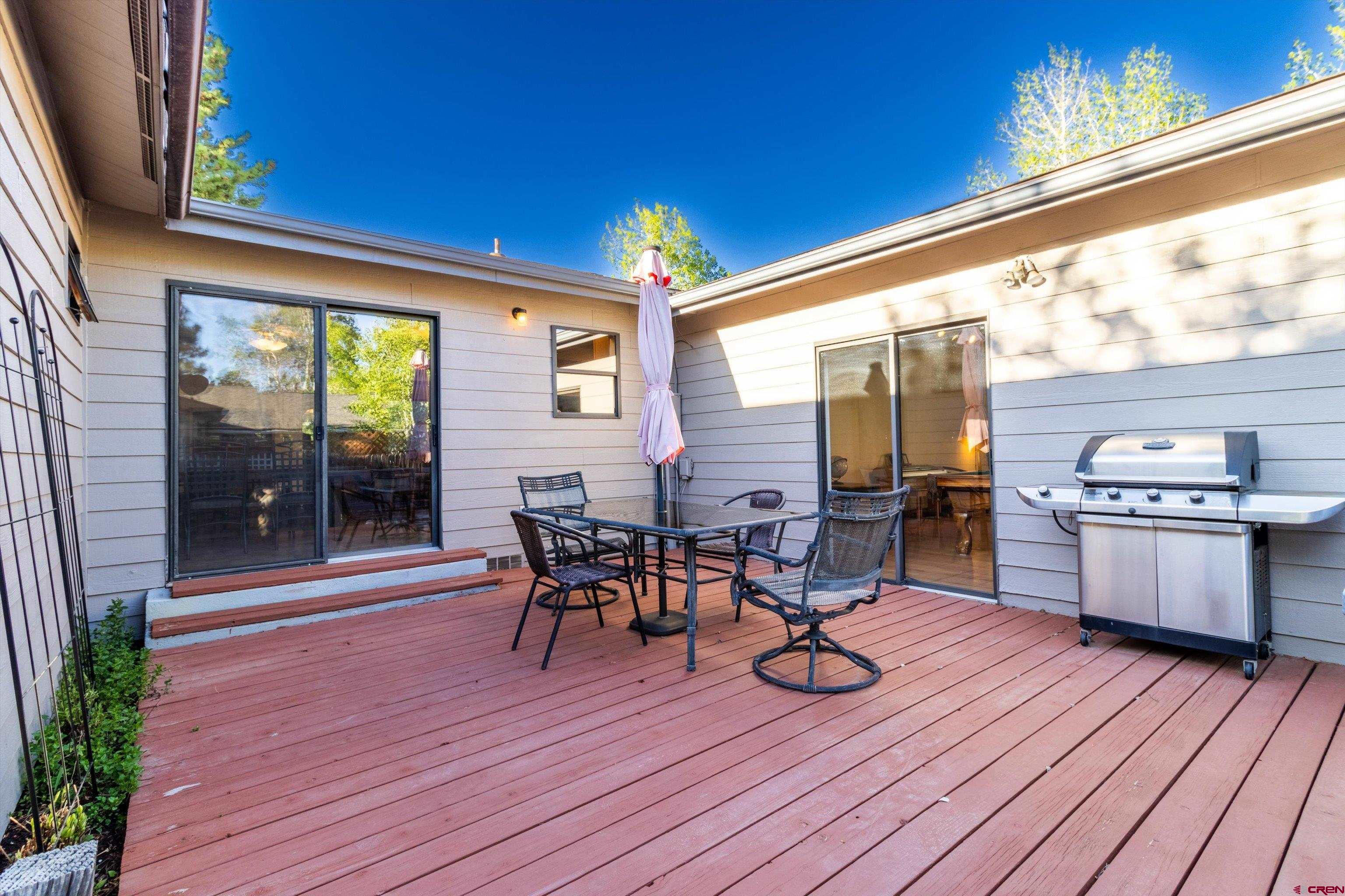 327 Hermosa Circle Durango, CO 81301 - Photo 25 of 32 a view of a dinning room with wooden floor and furniture