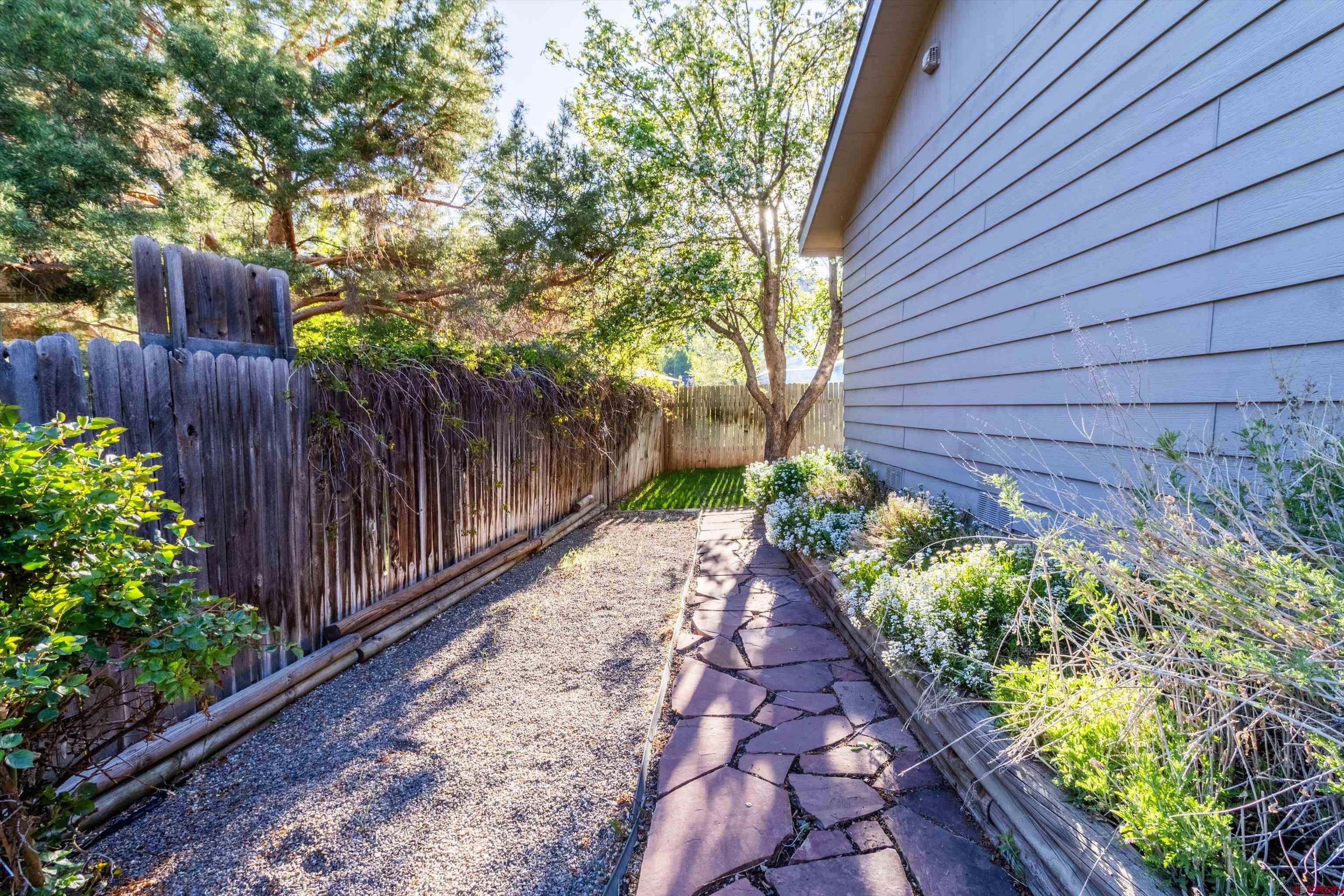327 Hermosa Circle Durango, CO 81301 - Photo 26 of 32 a view of a pathway with a flower
