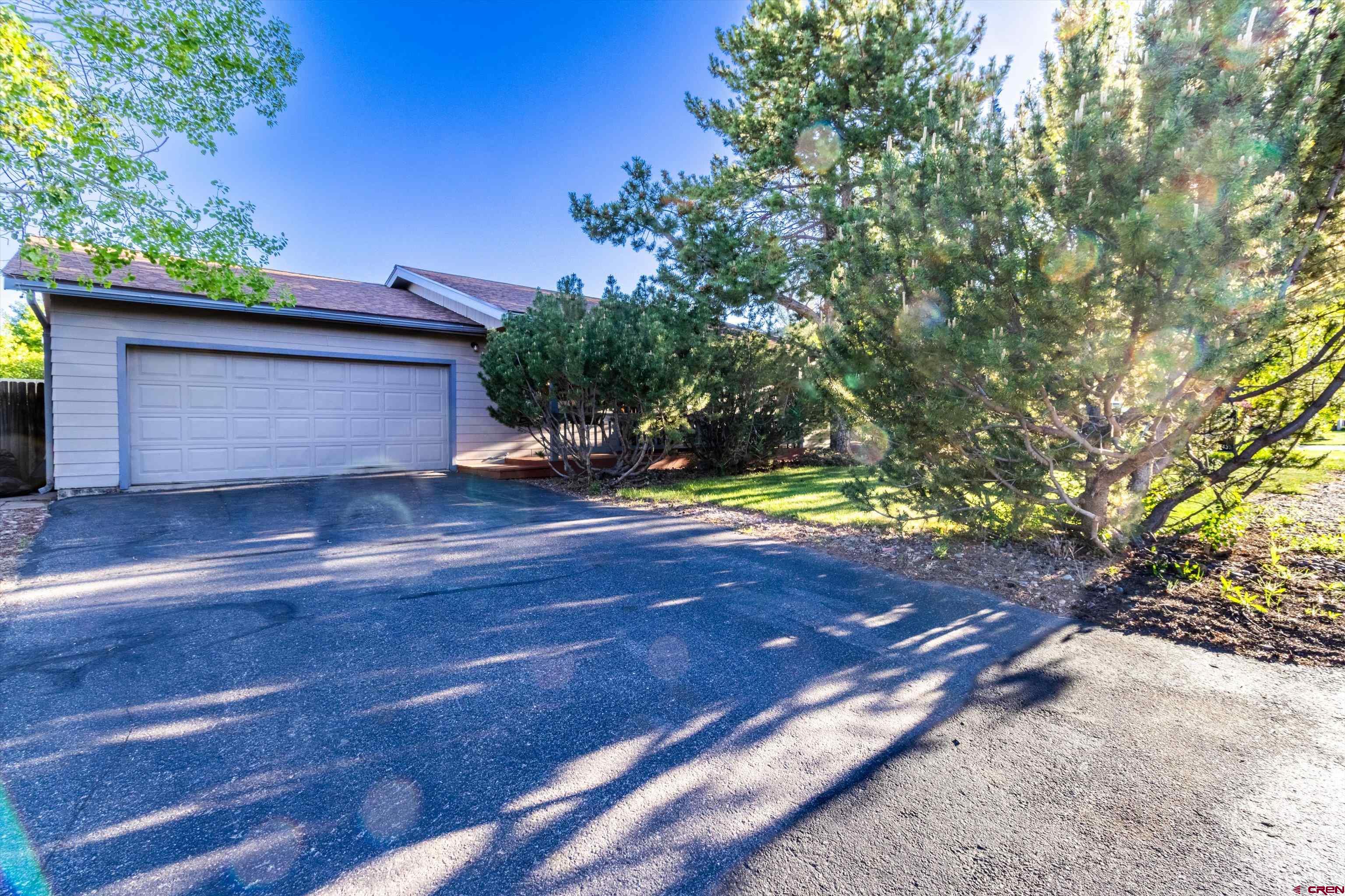 327 Hermosa Circle Durango, CO 81301 - Photo 30 of 32 a view of outdoor space with wooden floor and tree