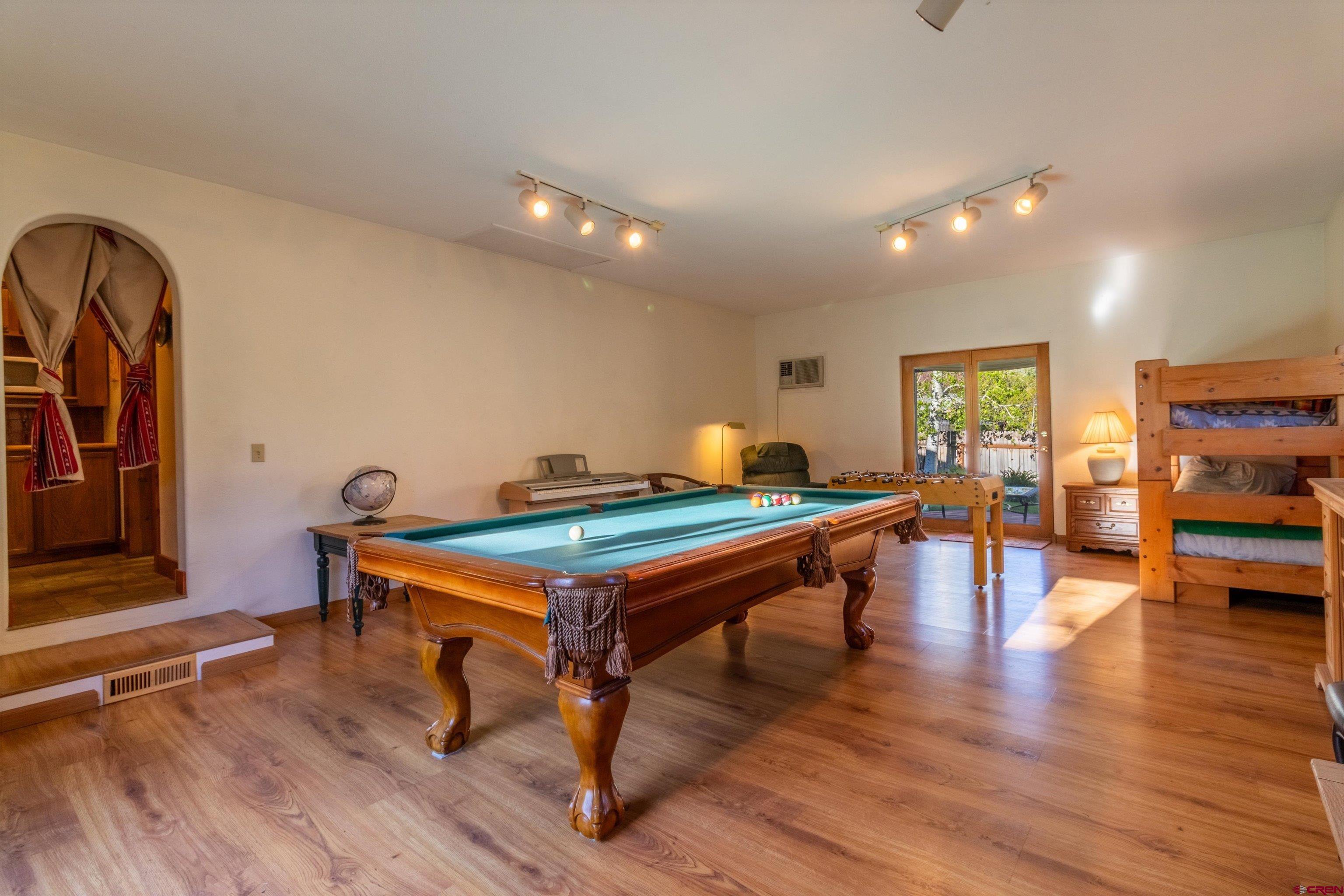 327 Hermosa Circle Durango, CO 81301 - Photo 9 of 32 a room with furniture pool table wooden floor and windows